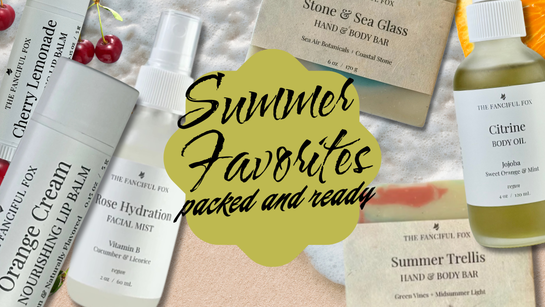 A collage-style promotional graphic showing several skincare or body care products arranged on a pale peach background with a large yellow-green oval reading 'Summer Favorites packed and ready.' Visible items include a white tube labeled Organic Cream, a white bottle labeled Hydrate, a clear bottle labeled Summer Trellis, and a white bottle labeled Mango & Sea Glass body wash.