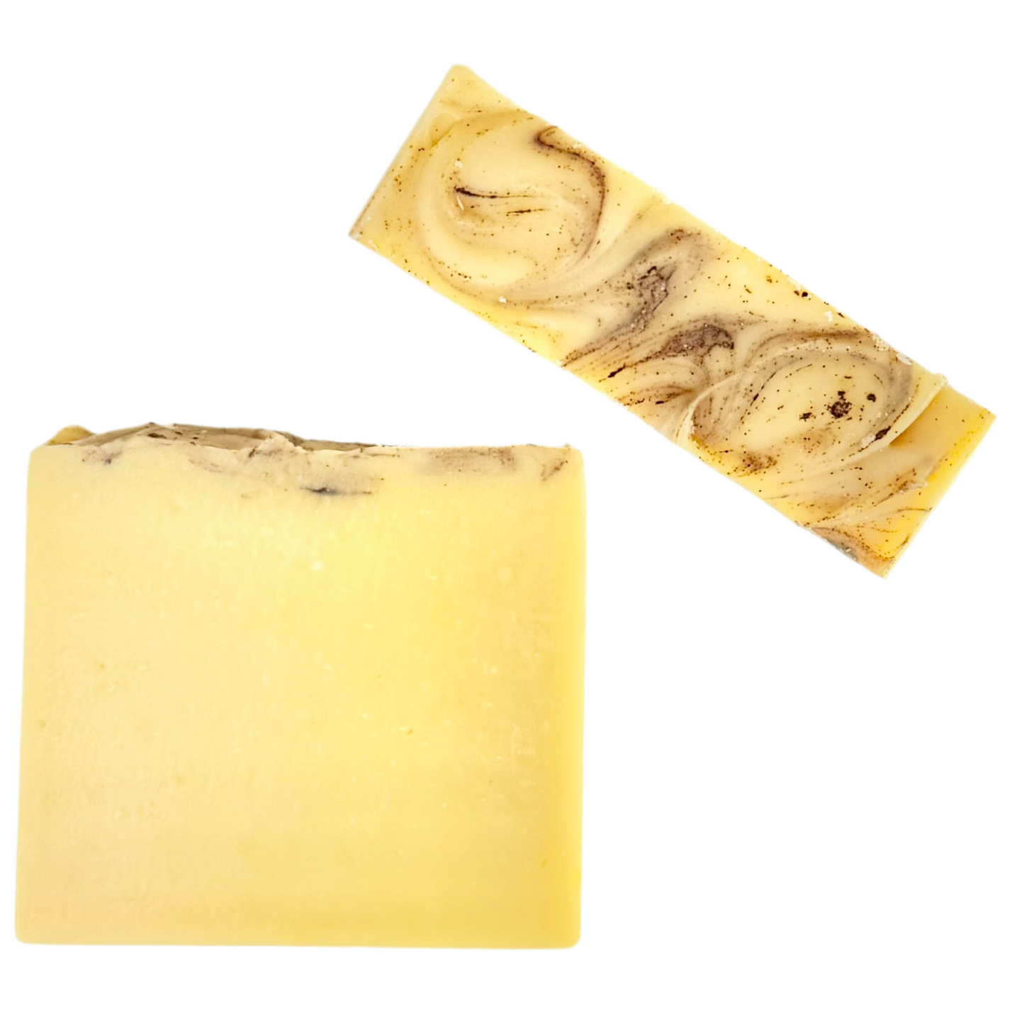 Two swirled yellow and brown soap bars on a white background