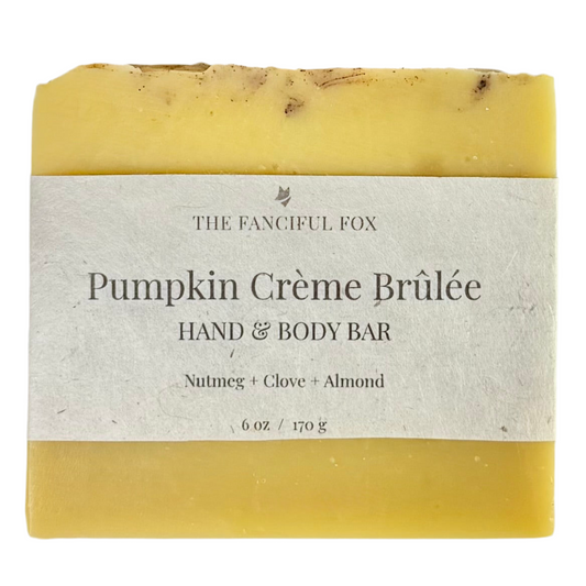 Yellow pumpkin crème brèlé soap bar with a label on a white background
