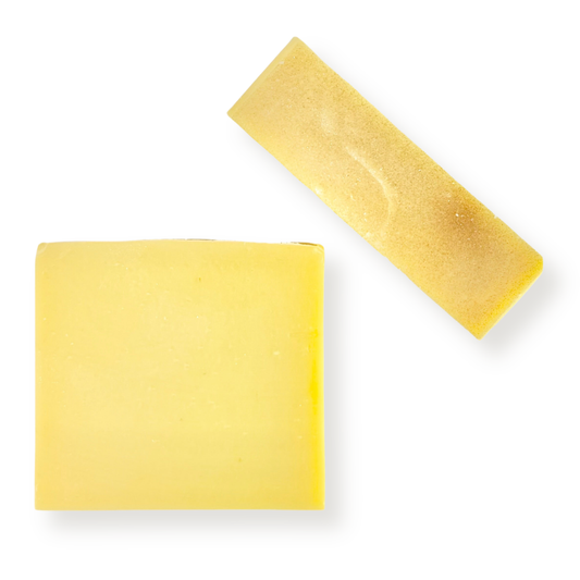 Two rectangular bars of pale yellow soap on a plain white background, one flat and one angled.